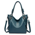 Alt text: Bolsa feminina de couro tote preta com alça dupla elegante.