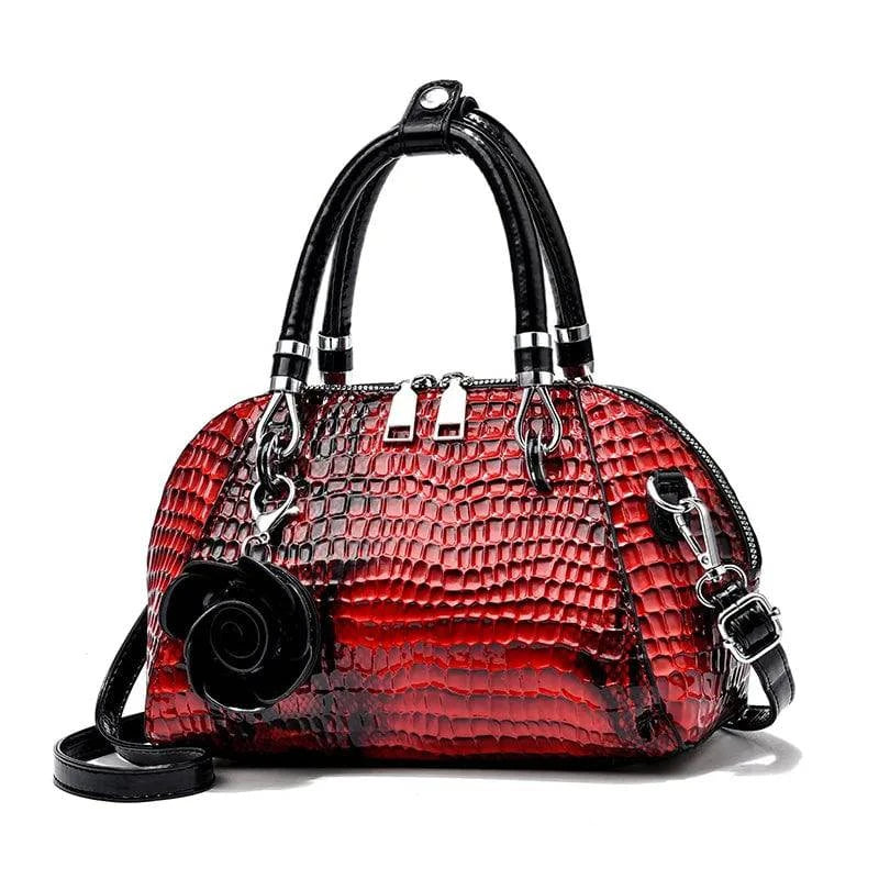 Bolsa de mão elegante Monarca em couro texturizado marrom.