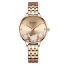 Relógio feminino Curren com mostrador floral e pulseira em tom ouro rosado