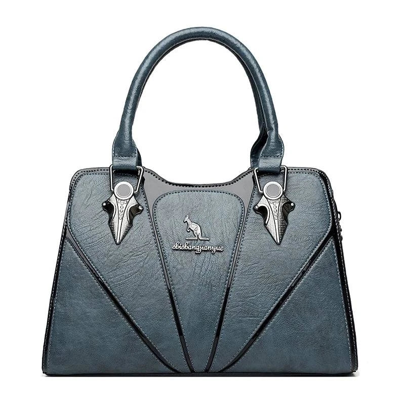 Alt text: Bolsa feminina de couro Monarque marrom com alça ajustável.