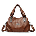 Alt text: Bolsa feminina de couro legítimo marrom com alça dupla elegante.