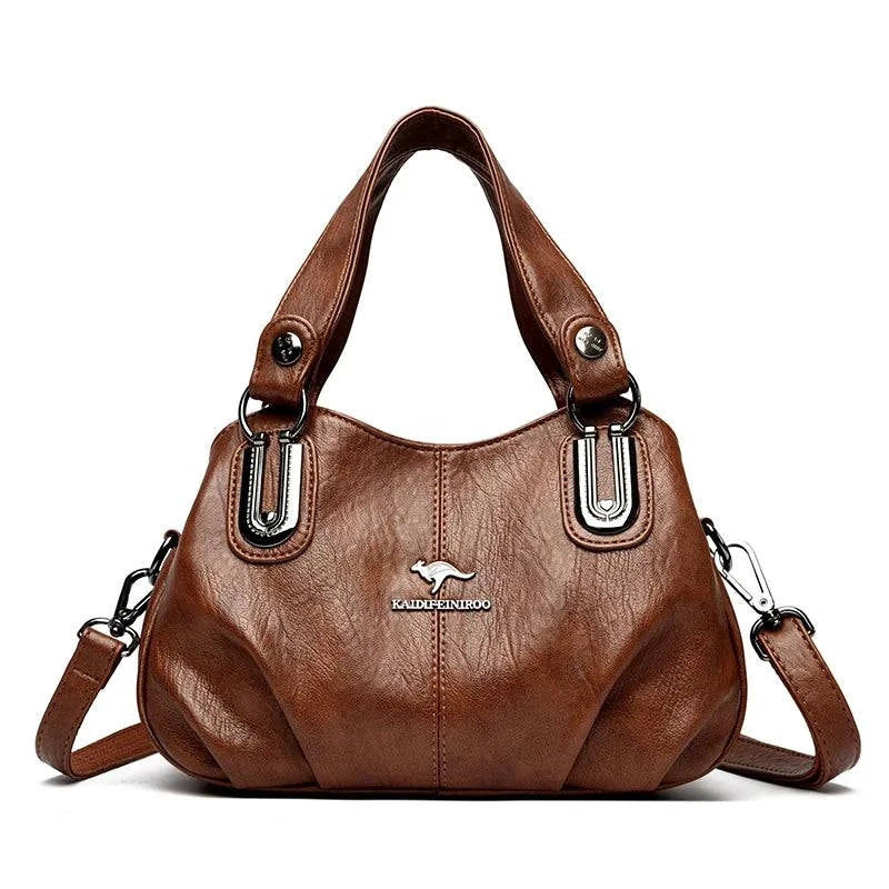 Alt text: Bolsa feminina de couro legítimo marrom com alça dupla elegante.