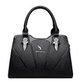 Alt text: Bolsa feminina de couro Monarque em tom marrom elegante.