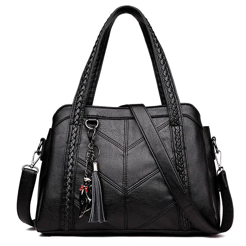 Alt text: Bolsa Tote Estruturada em Couro Marrom com Alça Extra.