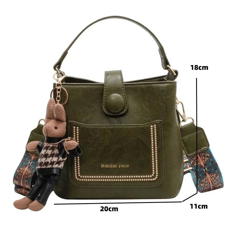 Alt text: Bolsa Tote feminina transversal pequena em tom neutro.