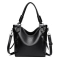 Alt text: Bolsa feminina de couro tote preta com alça dupla elegante.