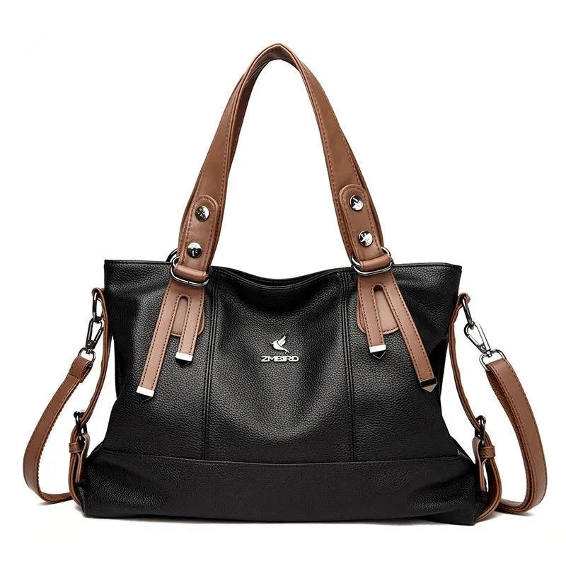 Alt text: Bolsa feminina de mão em couro genuíno marrom escuro.