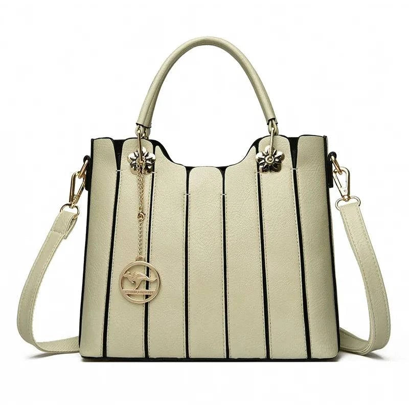 Alt text: Bolsa tote feminina em couro opale marrom claro.
