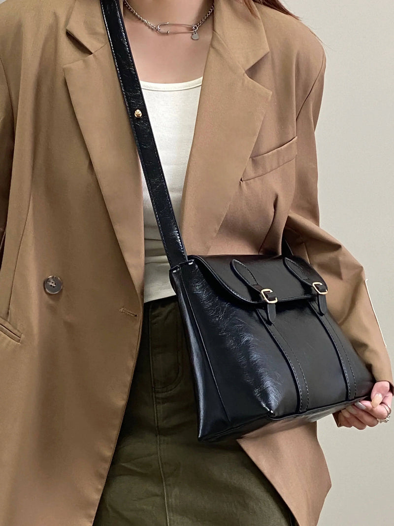 Alt text: Bolsa Satchel Feminina em Couro marrom elegante e espaçosa.