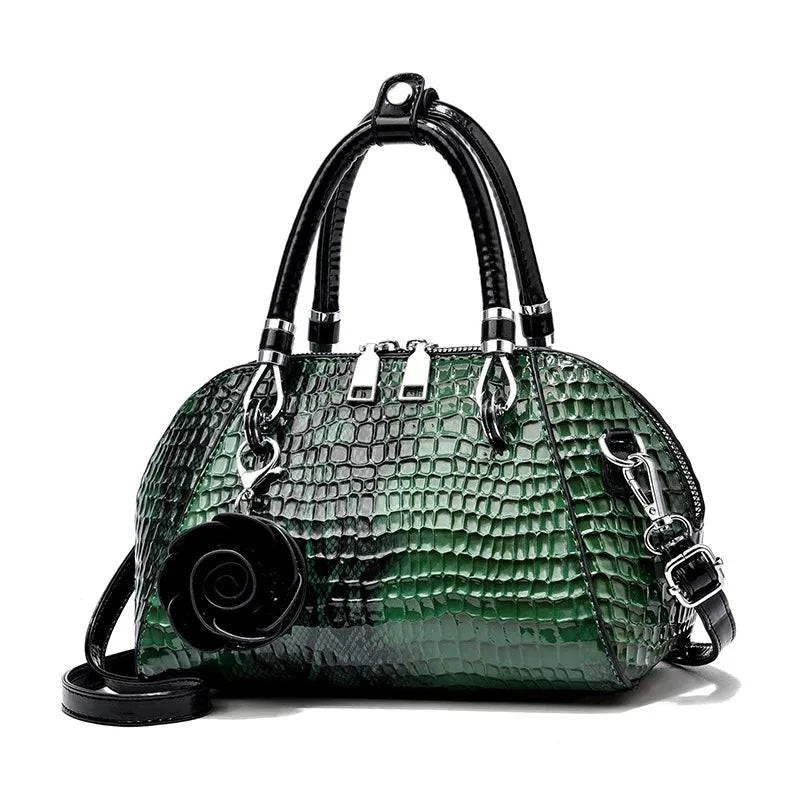 Bolsa de mão Monarca em couro texturizado marrom.