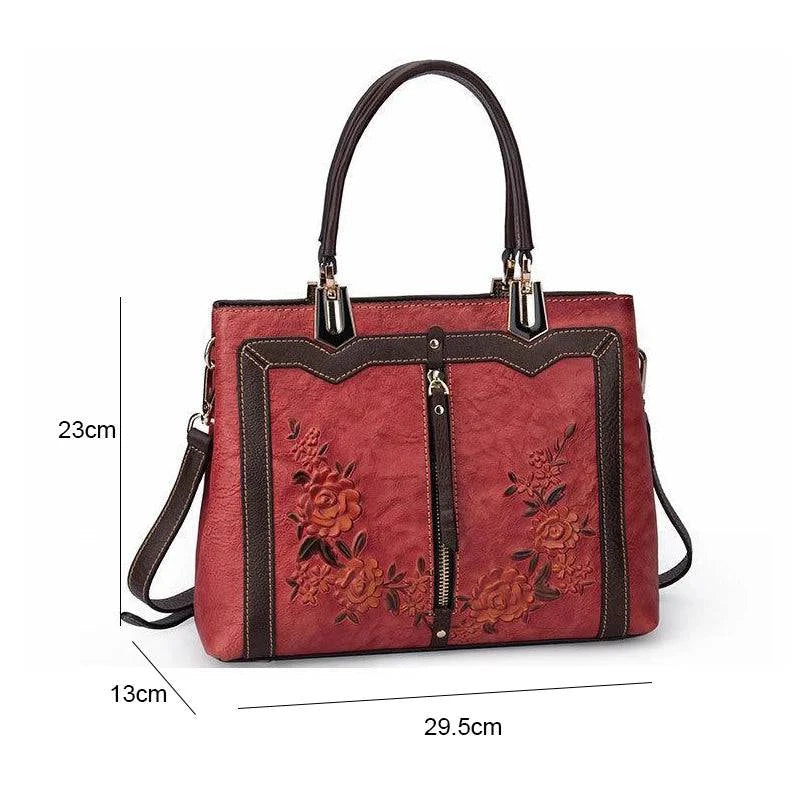 Alt text: Bolsa feminina de couro legítimo preta, elegante e sofisticada.