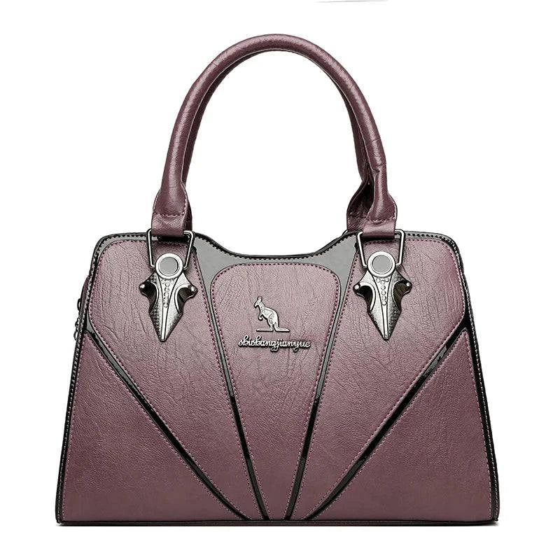 Alt text: Bolsa feminina de couro Monarque em tom marrom elegante.