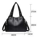 Bolsa feminina de couro preta com alças acolchoadas e dimensões 39x29x14cm