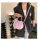 Bolsa bucket rosa texturizada com alças de mão e transversal