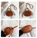Bolsa bucket texturizada em couro sintético caramelo, com alças de mão e correia ajustável, vistas frontal, lateral e