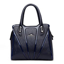 Bolsa feminina azul-marinho com alças duplas e detalhes de costura vertical