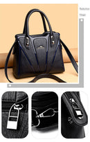 Bolsa crossbody feminina de couro preta com alças duplas e detalhes em azul