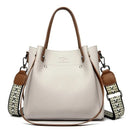 Bolsa tote de couro creme com alças marrom e alça transversal estampada