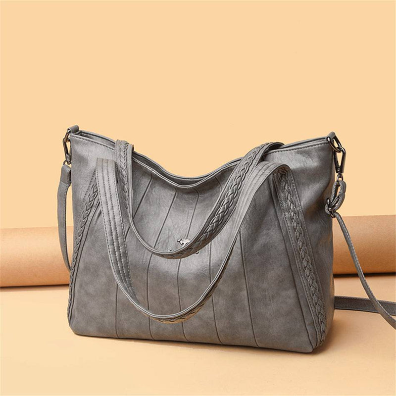 Bolsa Feminina Couro Horizon One cinza. Couro macio com frisos e alças trançadas. Logo metálico, alça transversal. Elegante e versátil.