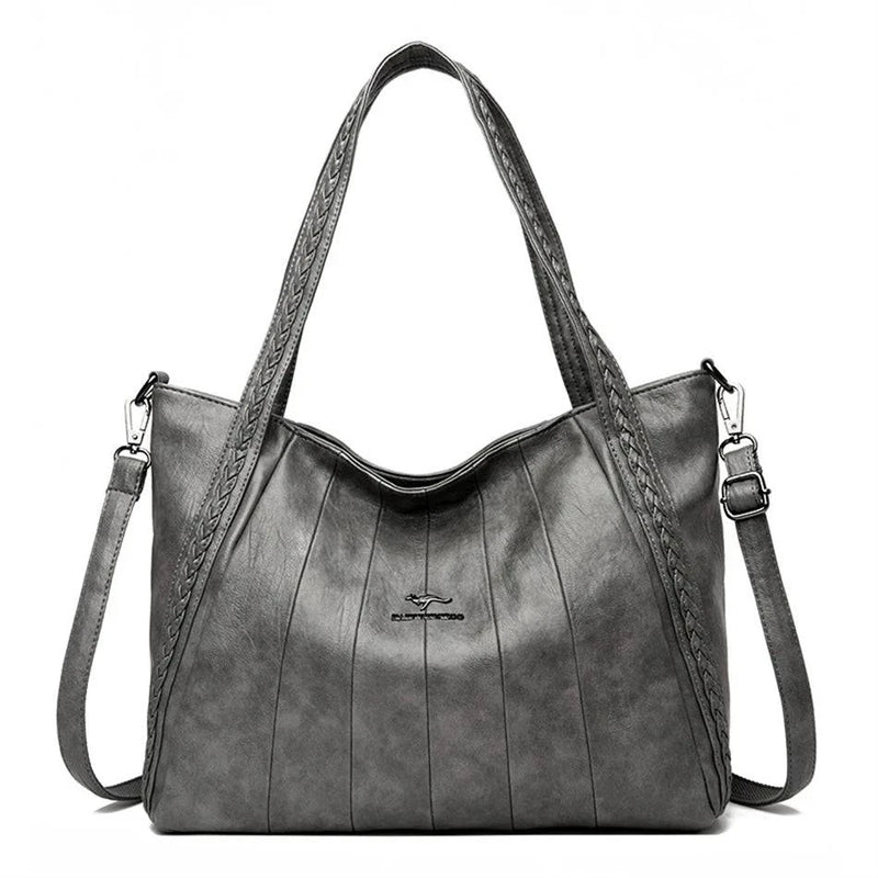 Bolsa Feminina Couro Horizon One cinza. Couro macio com frisos e alças trançadas. Logo metálico, alça transversal. Elegante e versátil.