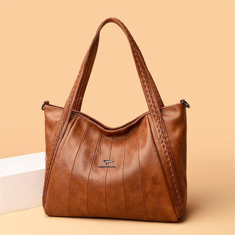 Bolsa Feminina Couro Horizon One marrom. Couro macio com frisos e alças trançadas. Logo metálico, alça transversal. Elegante e versátil.