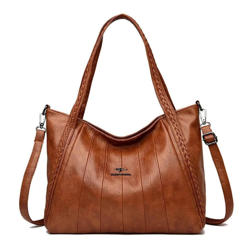 Bolsa Feminina Couro Horizon One marrom. Couro macio com frisos e alças trançadas. Logo metálico, alça transversal. Elegante e versátil.