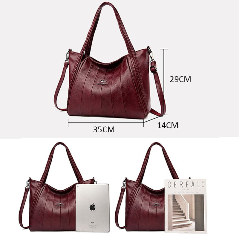 Bolsa Feminina Couro Horizon One vinho. Dimensões: 35x29x14cm. Espaçosa, ideal para tablet e itens diários. Alças trançadas. Prática e estilosa.