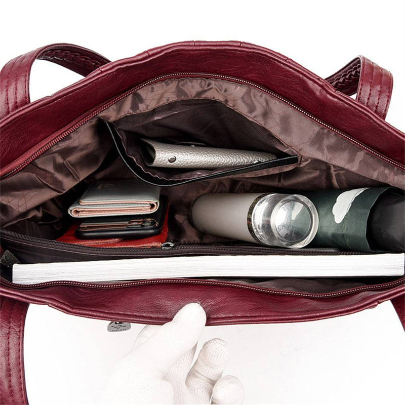 Bolsa Feminina Couro Horizon One vinho. Interior amplo com múltiplos compartimentos e bolsos. Ideal para organizar seus itens e uso diário com praticidade.
