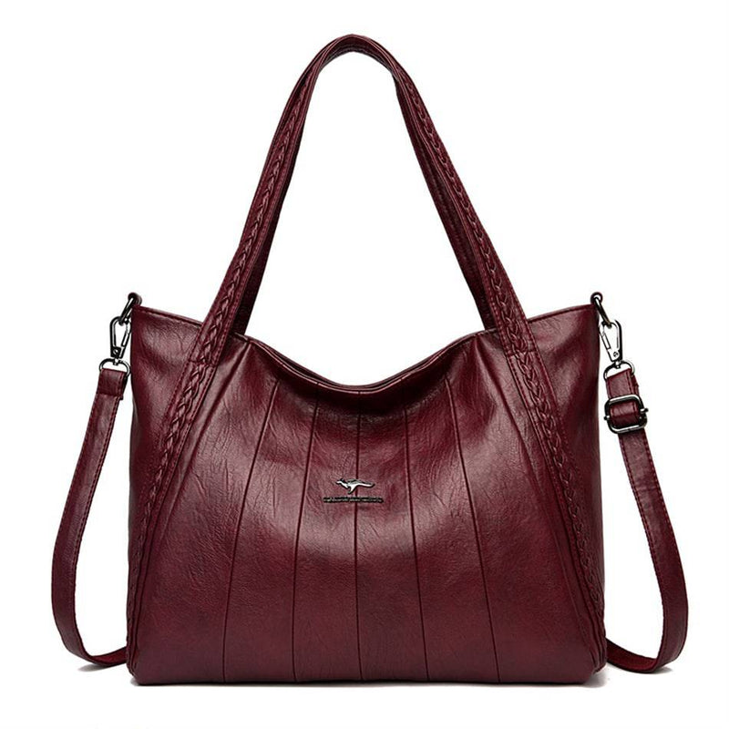 Bolsa Feminina Couro Horizon One vinho, couro macio com frisos frontais e alças trançadas. Alça transversal. Elegante e versátil.