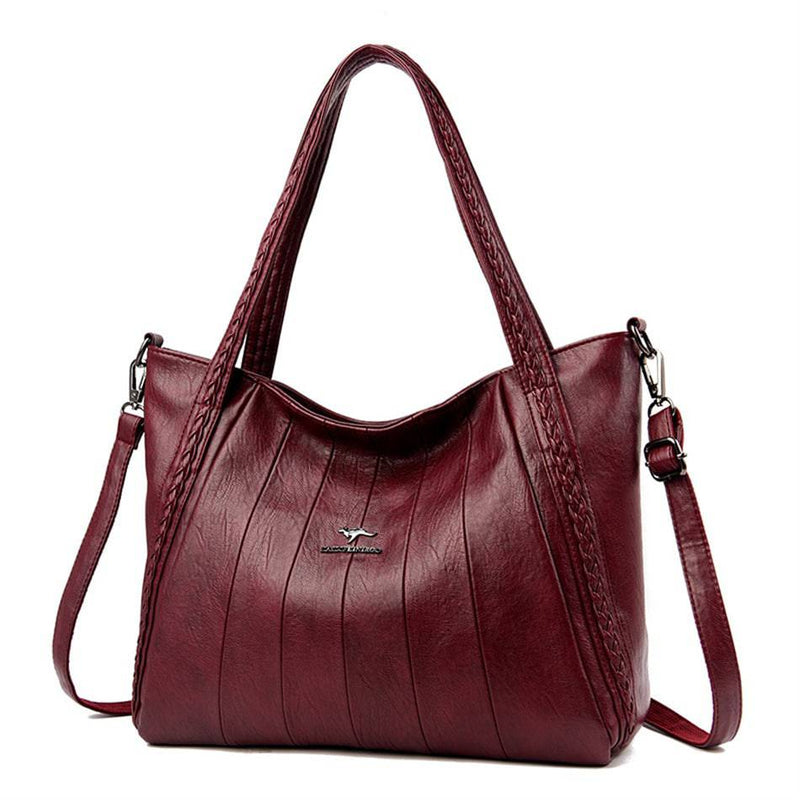 Bolsa Feminina Couro Horizon One vinho, couro macio com frisos frontais e alças trançadas. Alça transversal. Elegante e versátil.