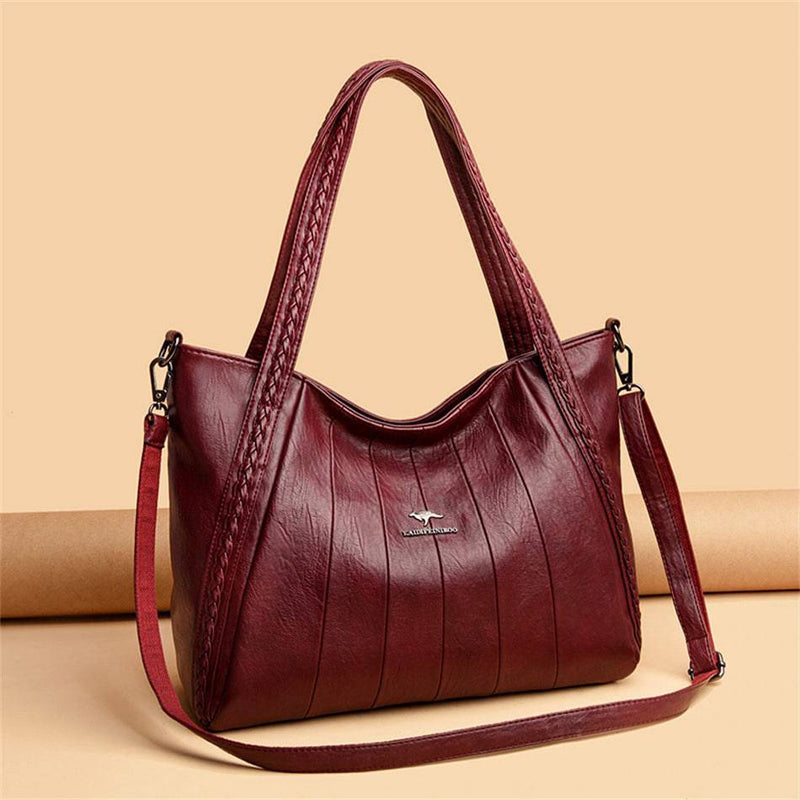 Bolsa Feminina de Couro Horizon One vinho, couro macio com frisos frontais e alças trançadas. Alça transversal. Elegante e versátil.