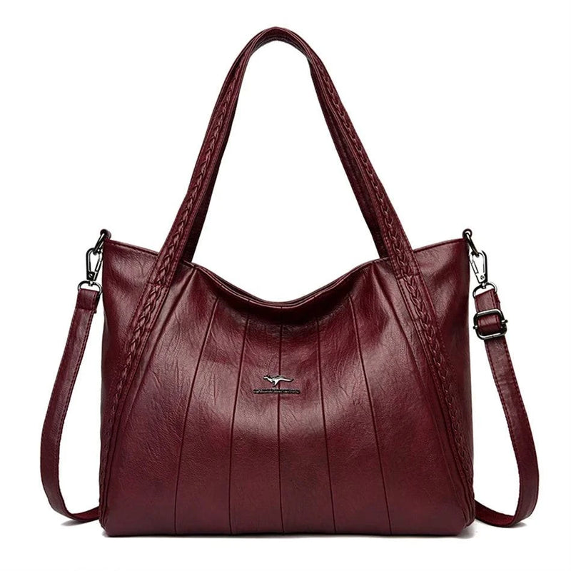Bolsa Feminina de Couro Horizon One vinho, couro macio com frisos frontais e alças trançadas. Alça transversal. Elegante e versátil.