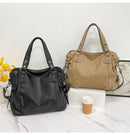 Bolsa feminina de couro preta e caramelo com alças de ombro