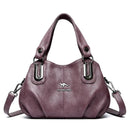 Bolsa feminina de couro roxo com alça dupla e alça transversal removível