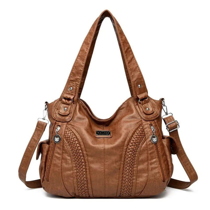 Bolsa feminina de couro legítimo marrom Charmonia com alça de ombro, detalhes trançados na frente, bolso com zíper lateral e ferragens prateadas, ideal para looks sofisticados e casuais.