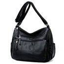 Bolsa feminina de couro preta com alça ajustável, bolsos com zíper e painel acolchoado