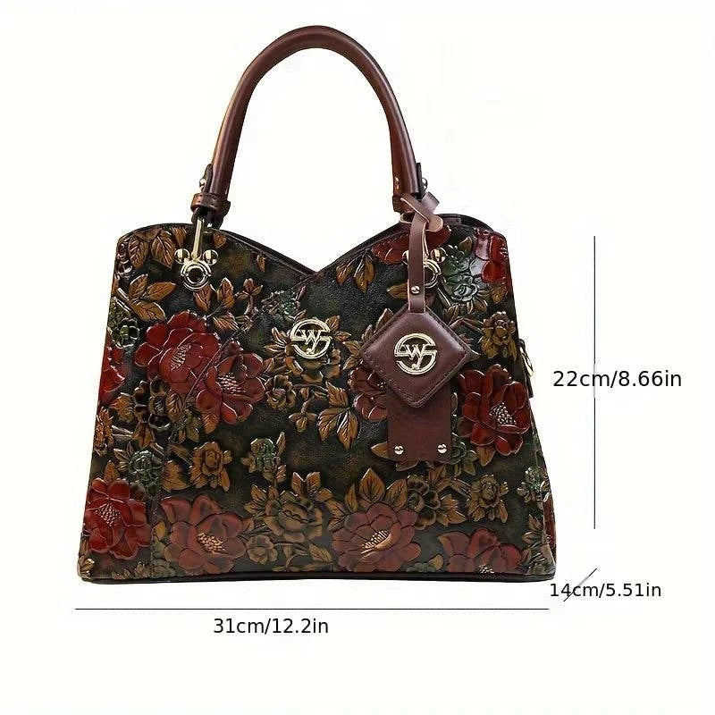 Bolsa Feminina de Couro Puro Luxo com estampa floral em relevo. Dimensões: 31x22x14cm. Alças de couro marrom. Estilo vintage e luxuoso.