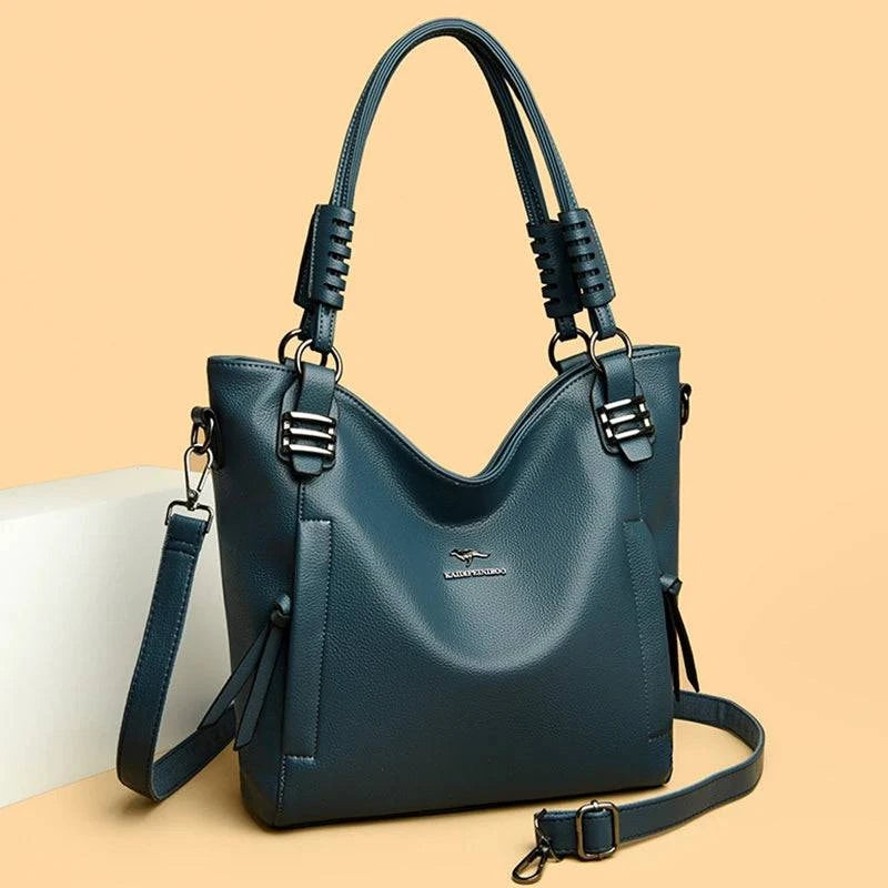 Bolsa Feminina de Couro Tote Com Alça Dupla azul petróleo. Couro texturizado, alças com detalhes em fivelas. Espaçosa e elegante para o dia a dia.