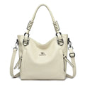 Bolsa Feminina de Couro Tote Com Alça Dupla off-white. Design estruturado, couro texturizado e alças com detalhe de fivelas. Elegante e versátil.