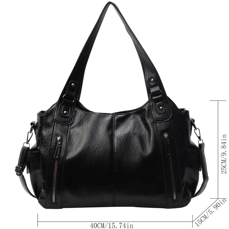 Bolsa feminina hobo em couro preto com alças duplas, detalhes em zíper e dimensões destacadas: 40cm de largura, 25cm de altura e 15cm de profundidade.