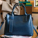 Bolsa tote de couro azul marinho com alças duplas e detalhes em costura contrastante
