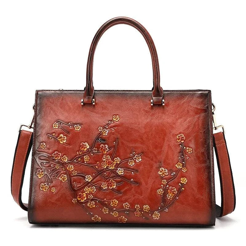 Bolsa Feminina Tote Couro Legítimo Imperix marrom, com relevo floral colorido. Design estruturado, alças de mão e transversal. Estilo vintage e único.