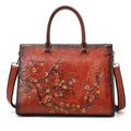 Bolsa Feminina Tote Couro Legítimo Imperix marrom, com relevo floral colorido. Design estruturado, alças de mão e transversal. Estilo vintage e único.