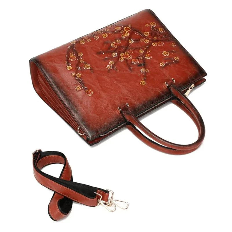 Bolsa Feminina Tote Couro Legítimo Imperix terracota, com relevo floral colorido. Alça transversal ajustável, alças de mão. Estilo vintage e único.