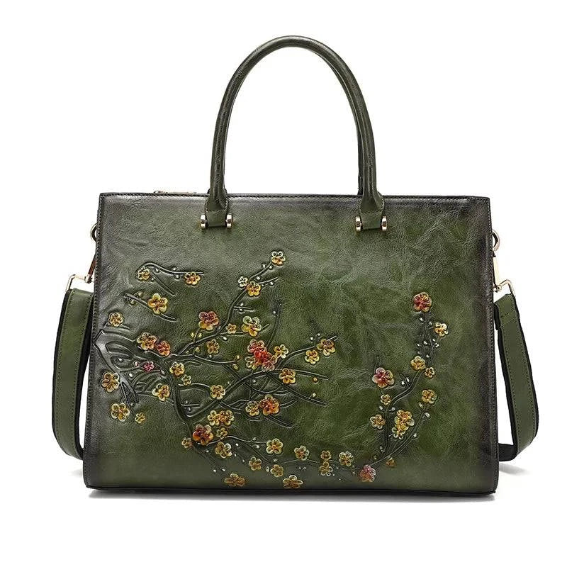 Bolsa Feminina Tote Couro Legítimo Imperix verde-militar, com relevo floral em tons quentes. Design estruturado, alças de mão e transversal. Estilo vintage e único.