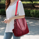 Bolsa mochila feminina de couro vinho com alça transversal