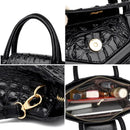 Bolsa satchel preta de couro com fecho magnético, alças duplas, detalhe interior organizado e acabamento texturizado