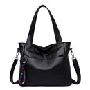 Bolsa tote de couro preto com alça de ombro e transversal ajustável
