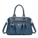 Bolsa tote feminina azul estruturada com alças duplas, zíper frontal e ferragens prateadas