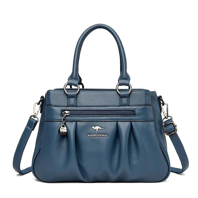 Bolsa Tote Estruturada Feminina Couro Radiance azul petróleo. Zíper frontal, pregas, ferragens prateadas. Elegante e funcional para o dia a dia.